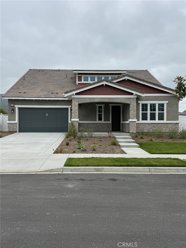 378 Wisteria St, Fillmore, CA 93015 - view of front of property featuring concrete driveway, a porch, and an attached garage