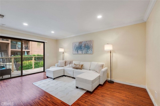 living room with crown molding, recessed lighting, baseboards, and wood finished floors