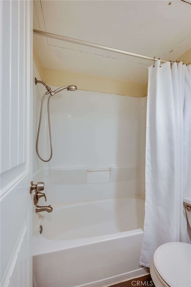 full bathroom with toilet and shower / bath combo