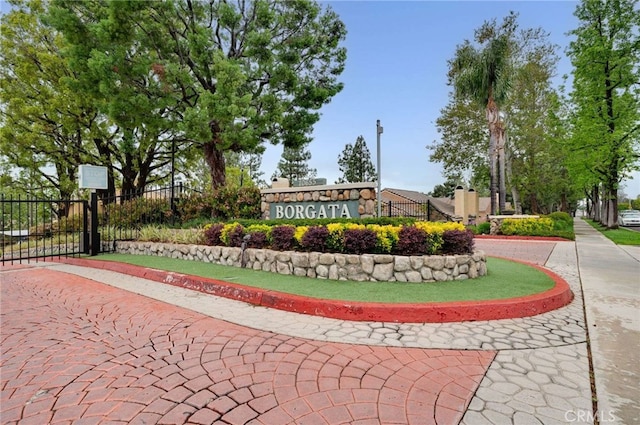 community sign featuring fence