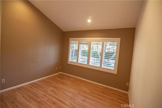 3926 Corte Cancion, Thousand Oaks, CA 91360 - spare room featuring light wood finished floors, baseboards, and lofted ceiling