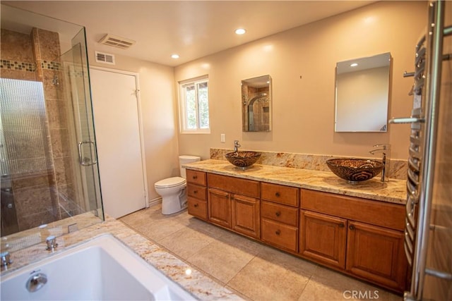 3926 Corte Cancion, Thousand Oaks, CA 91360 - bathroom with a sink, toilet, a stall shower, and visible vents