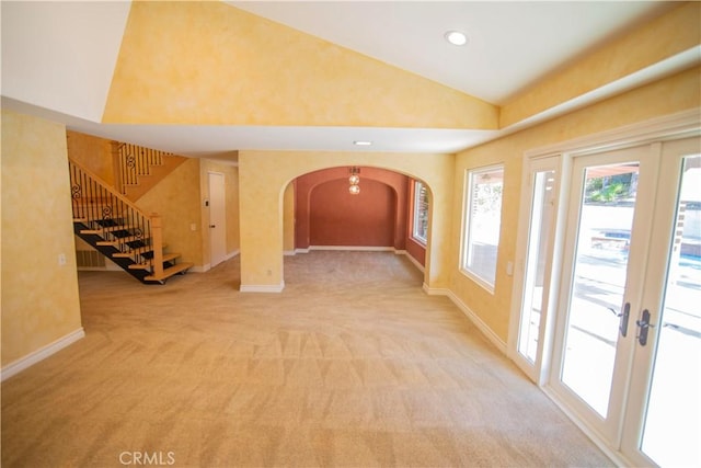 3926 Corte Cancion, Thousand Oaks, CA 91360 - carpeted foyer with french doors, baseboards, arched walkways, lofted ceiling, and stairs