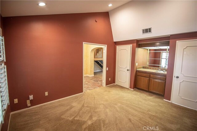 3926 Corte Cancion, Thousand Oaks, CA 91360 - interior space featuring recessed lighting, visible vents, high vaulted ceiling, arched walkways, and light colored carpet