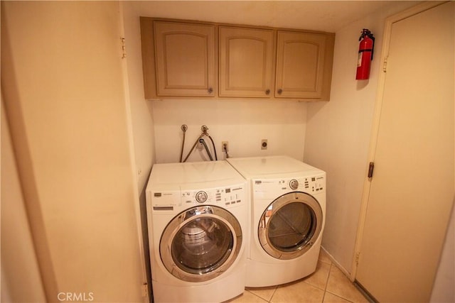 3926 Corte Cancion, Thousand Oaks, CA 91360 - washroom featuring cabinet space, washing machine and clothes dryer, and light tile patterned floors