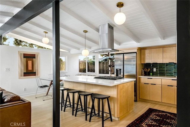 3130 Kallin Ave, Long Beach, CA 90808 - kitchen with island range hood, light countertops, a kitchen island, a breakfast bar, and light wood-style floors