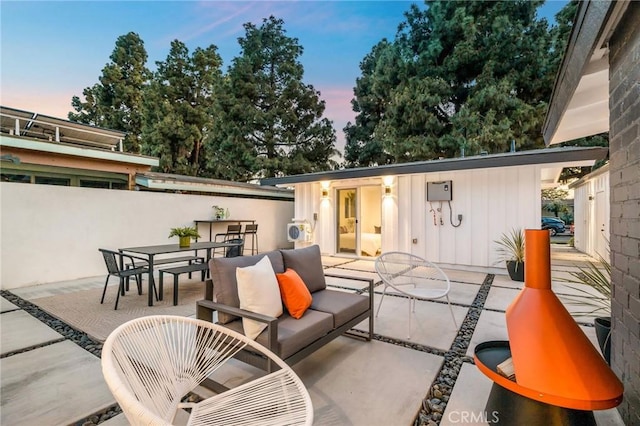 3130 Kallin Ave, Long Beach, CA 90808 - patio terrace at dusk with outdoor dining space