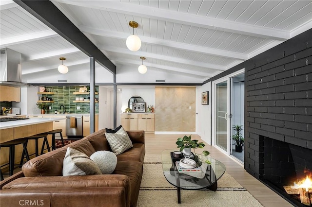 3130 Kallin Ave, Long Beach, CA 90808 - living area featuring light wood-type flooring and a fireplace