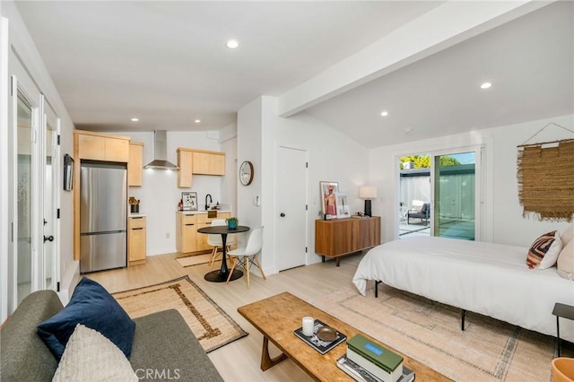 3130 Kallin Ave, Long Beach, CA 90808 - bedroom featuring freestanding refrigerator, light wood finished floors, recessed lighting, and access to exterior
