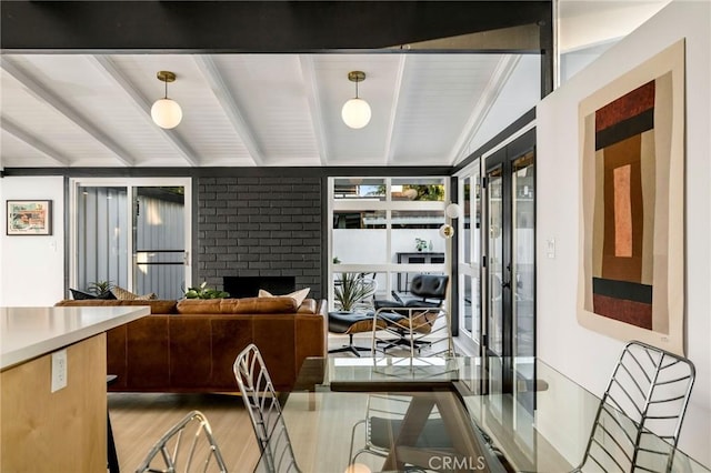 3130 Kallin Ave, Long Beach, CA 90808 - dining area featuring light wood-type flooring and a brick fireplace