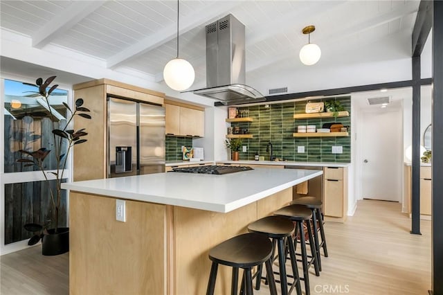 3130 Kallin Ave, Long Beach, CA 90808 - kitchen with stainless steel fridge, island range hood, backsplash, light brown cabinetry, and beamed ceiling