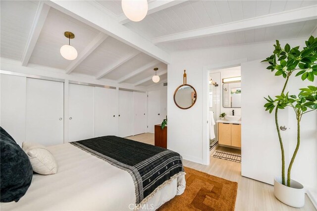 3130 Kallin Ave, Long Beach, CA 90808 - bedroom featuring light wood-style floors, two closets, ensuite bathroom, and a sink