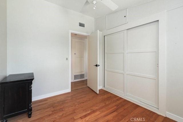 1229 Kilson Dr, Santa Ana, CA 92707 - unfurnished bedroom with wood finished floors, baseboards, and a closet