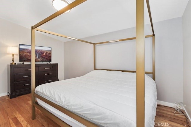 1229 Kilson Dr, Santa Ana, CA 92707 - bedroom featuring wood finished floors and baseboards