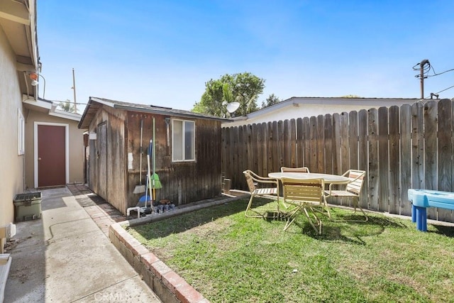 1229 Kilson Dr, Santa Ana, CA 92707 - view of yard featuring an outbuilding and a patio