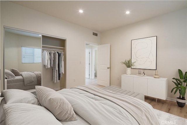 1271 S Sycamore Ave, Los Angeles, CA 90019 - bedroom with a closet, visible vents, wood finished floors, and recessed lighting