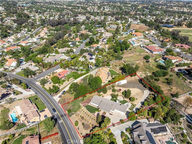 aerial view of residential area featuring property parcel outlined
