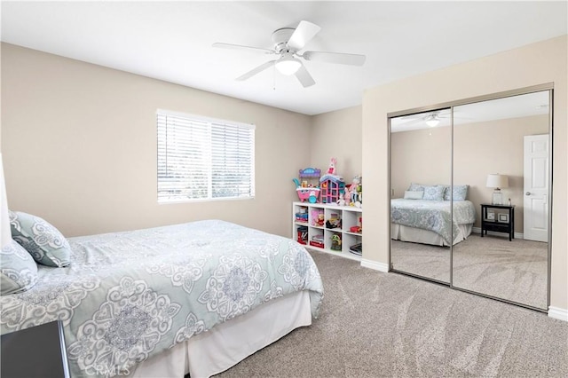 bedroom with carpet flooring, a closet, a ceiling fan, and baseboards