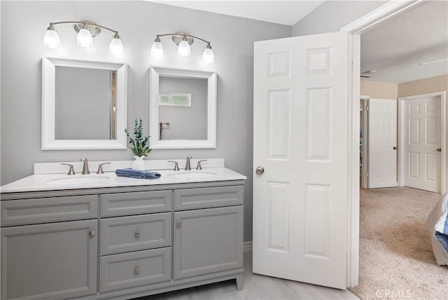 bathroom featuring double vanity
