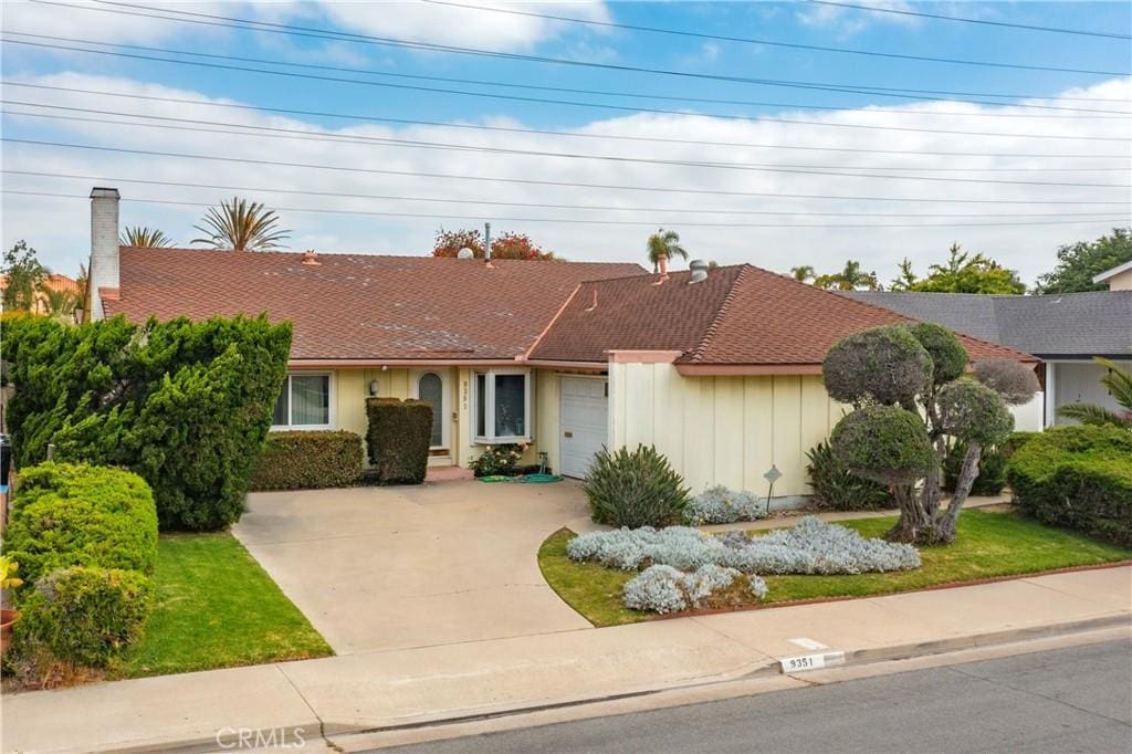 9351 Southshore Dr, Huntington Beach, CA 92646 - single story home featuring concrete driveway and a garage