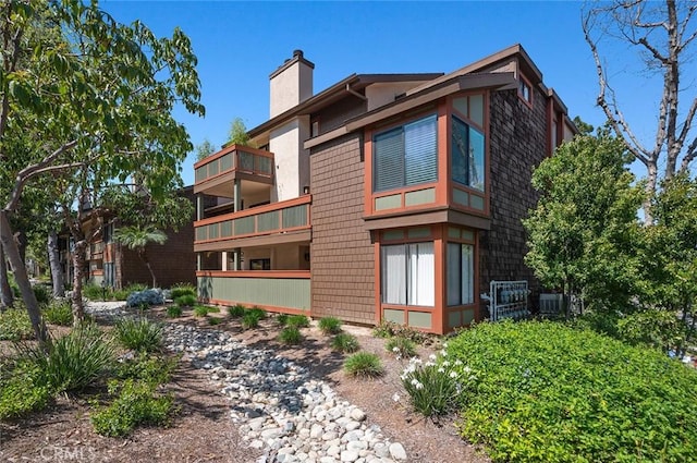 view of property featuring central AC unit