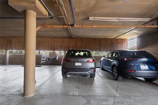 parking garage featuring wood walls
