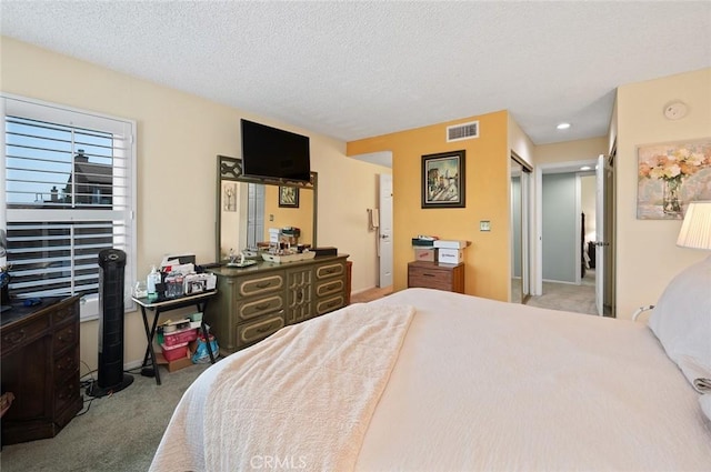 carpeted bedroom featuring a textured ceiling, baseboards, visible vents, and recessed lighting