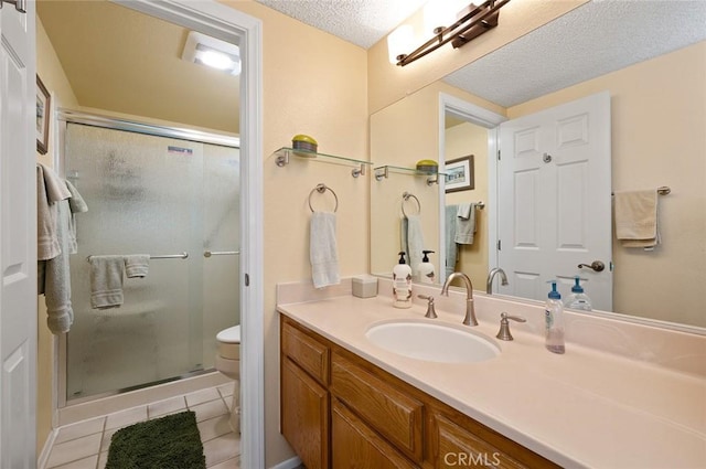 full bath featuring vanity, toilet, a shower stall, and tile patterned floors