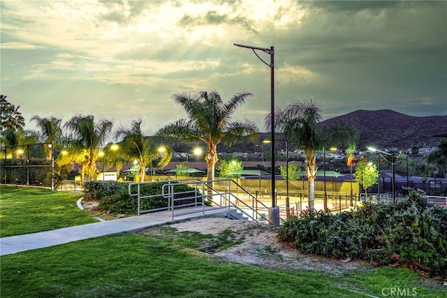 30247 Yellow Feather Dr, Canyon Lake, CA 92587 - view of home's community with a lawn, a mountain view, and fence
