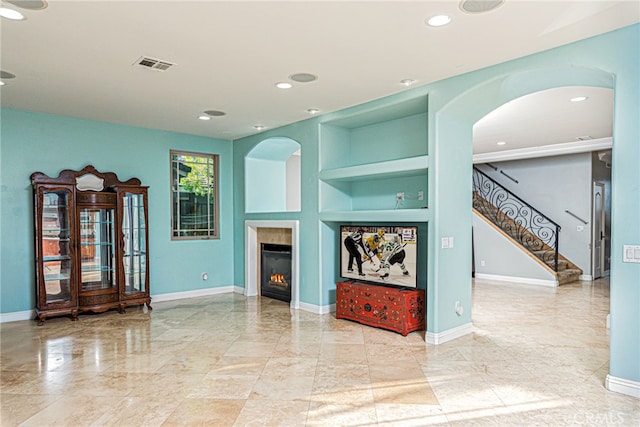 30247 Yellow Feather Dr, Canyon Lake, CA 92587 - unfurnished living room featuring visible vents, built in shelves, and baseboards