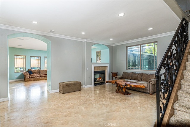 30247 Yellow Feather Dr, Canyon Lake, CA 92587 - living room featuring arched walkways, crown molding, a tiled fireplace, and visible vents