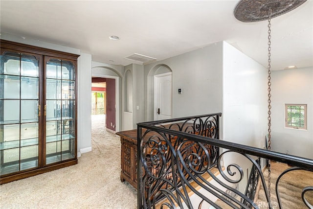 30247 Yellow Feather Dr, Canyon Lake, CA 92587 - hallway featuring light colored carpet, baseboards, arched walkways, and recessed lighting