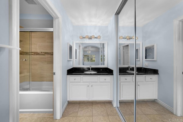 9939 Erma Rd Unit 101, San Diego, CA 92131 - bathroom featuring tile patterned floors, two vanities, and a sink
