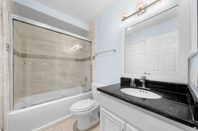 9939 Erma Rd Unit 101, San Diego, CA 92131 - full bathroom with vanity, toilet, shower / bath combination with glass door, and tile patterned flooring