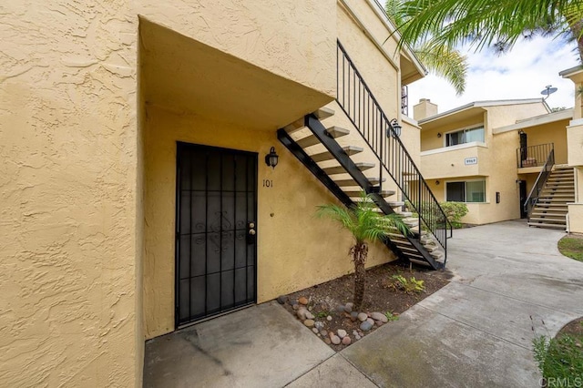 9939 Erma Rd Unit 101, San Diego, CA 92131 - view of exterior entry with stucco siding