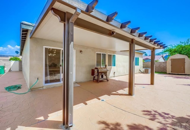 26841 Franklin Ave, Winchester, CA 92596 - view of patio / terrace featuring fence, a grill, an outdoor structure, central AC unit, and a storage unit