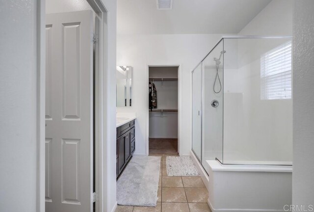 26841 Franklin Ave, Winchester, CA 92596 - full bath featuring visible vents, a shower stall, tile patterned flooring, vanity, and a walk in closet