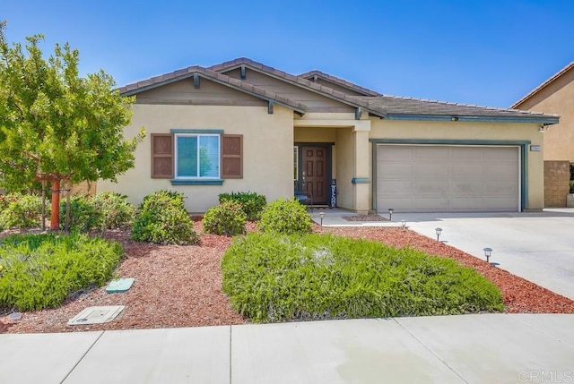 26841 Franklin Ave, Winchester, CA 92596 - view of front of property featuring stucco siding, driveway, and a garage
