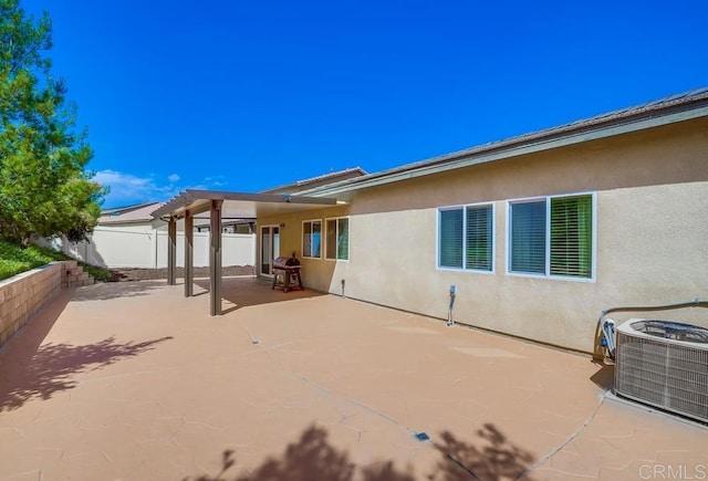 26841 Franklin Ave, Winchester, CA 92596 - rear view of property with central AC unit, stucco siding, a fenced backyard, and a patio