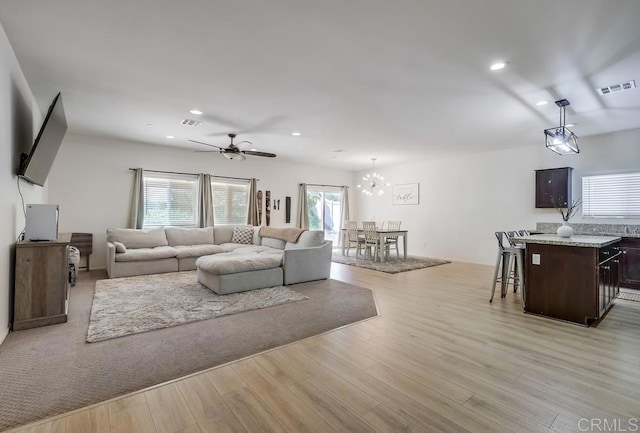 26841 Franklin Ave, Winchester, CA 92596 - living room with ceiling fan with notable chandelier, light wood-type flooring, visible vents, and recessed lighting