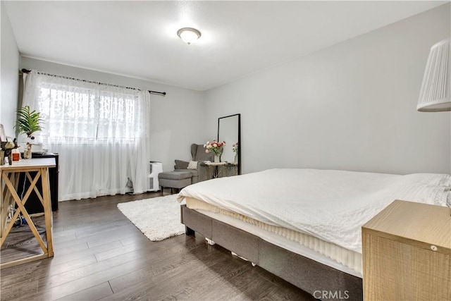 bedroom featuring wood finished floors