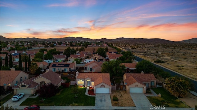 1009 Fairwind Ave, Rosamond, CA 93560 - aerial view at dusk with a residential view and a mountain view