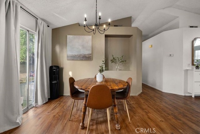 1009 Fairwind Ave, Rosamond, CA 93560 - dining room featuring lofted ceiling, wood finished floors, visible vents, an inviting chandelier, and baseboards