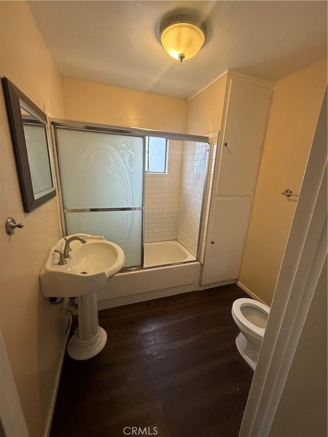 3754 Grace Ave, Baldwin Park, CA 91706 - full bathroom featuring toilet, wood finished floors, and a sink
