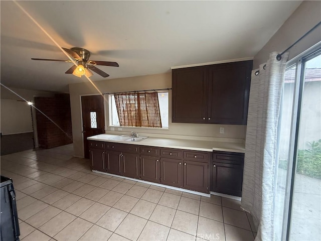 3754 Grace Ave, Baldwin Park, CA 91706 - kitchen with a sink, light tile patterned flooring, ceiling fan, dark brown cabinetry, and light countertops