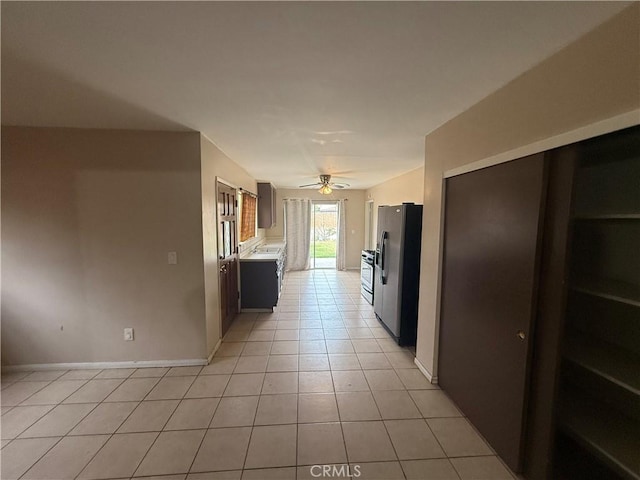 3754 Grace Ave, Baldwin Park, CA 91706 - kitchen featuring light tile patterned floors, baseboards, refrigerator with ice dispenser, ceiling fan, and light countertops