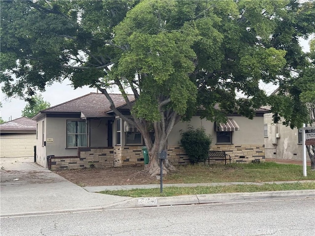 3754 Grace Ave, Baldwin Park, CA 91706 - view of front of property with driveway, an outbuilding, a garage, stucco siding, and stone siding