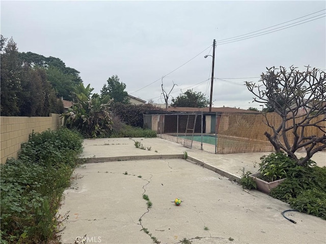 3754 Grace Ave, Baldwin Park, CA 91706 - view of yard with a patio area, fence, and an outbuilding