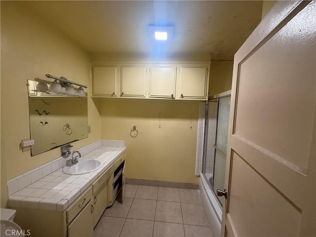3754 Grace Ave, Baldwin Park, CA 91706 - bathroom with vanity, baseboards, bath / shower combo with glass door, and tile patterned floors
