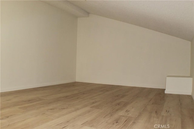 44406 15th St E Unit 13, Lancaster, CA 93535 - additional living space featuring vaulted ceiling and light wood-type flooring